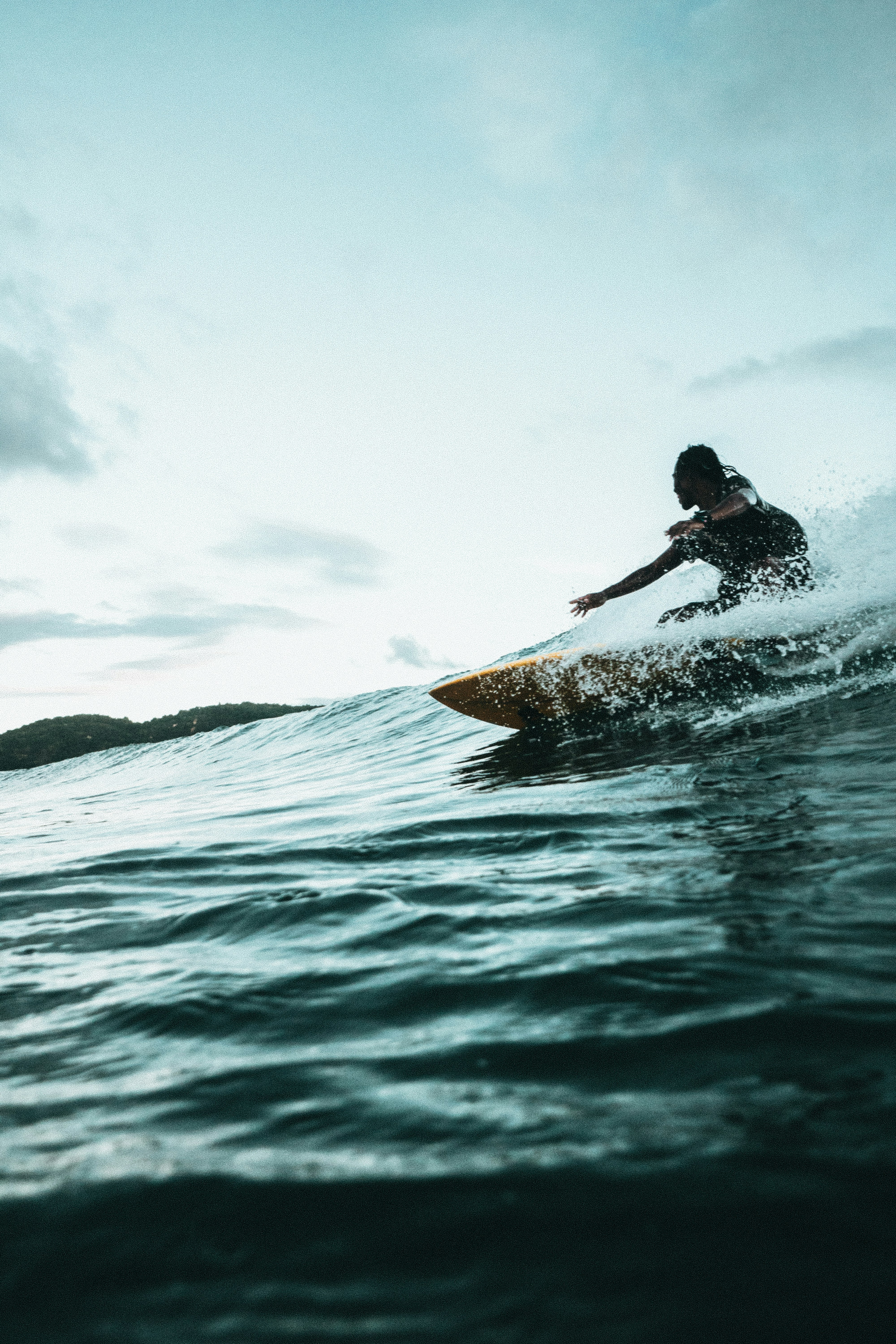 Surfing at Gerupuk Bay, Lombok, Indonesia
