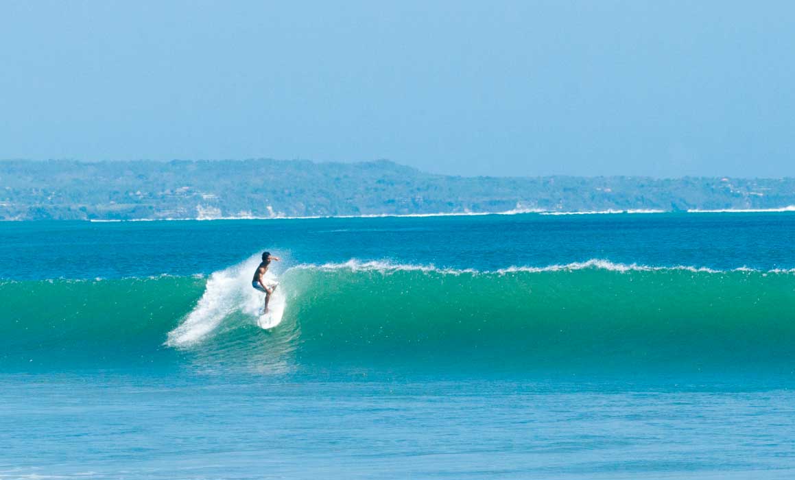 Surfing at Kuta Beach, Bali, Indonesia