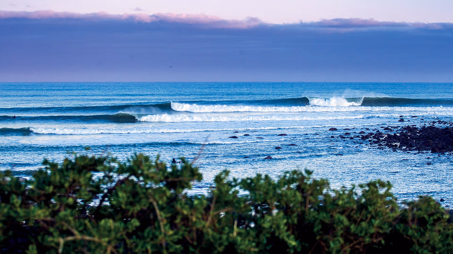 Surfing at New Plymouth (Fitzroy Beach), Taranaki, New Zealand