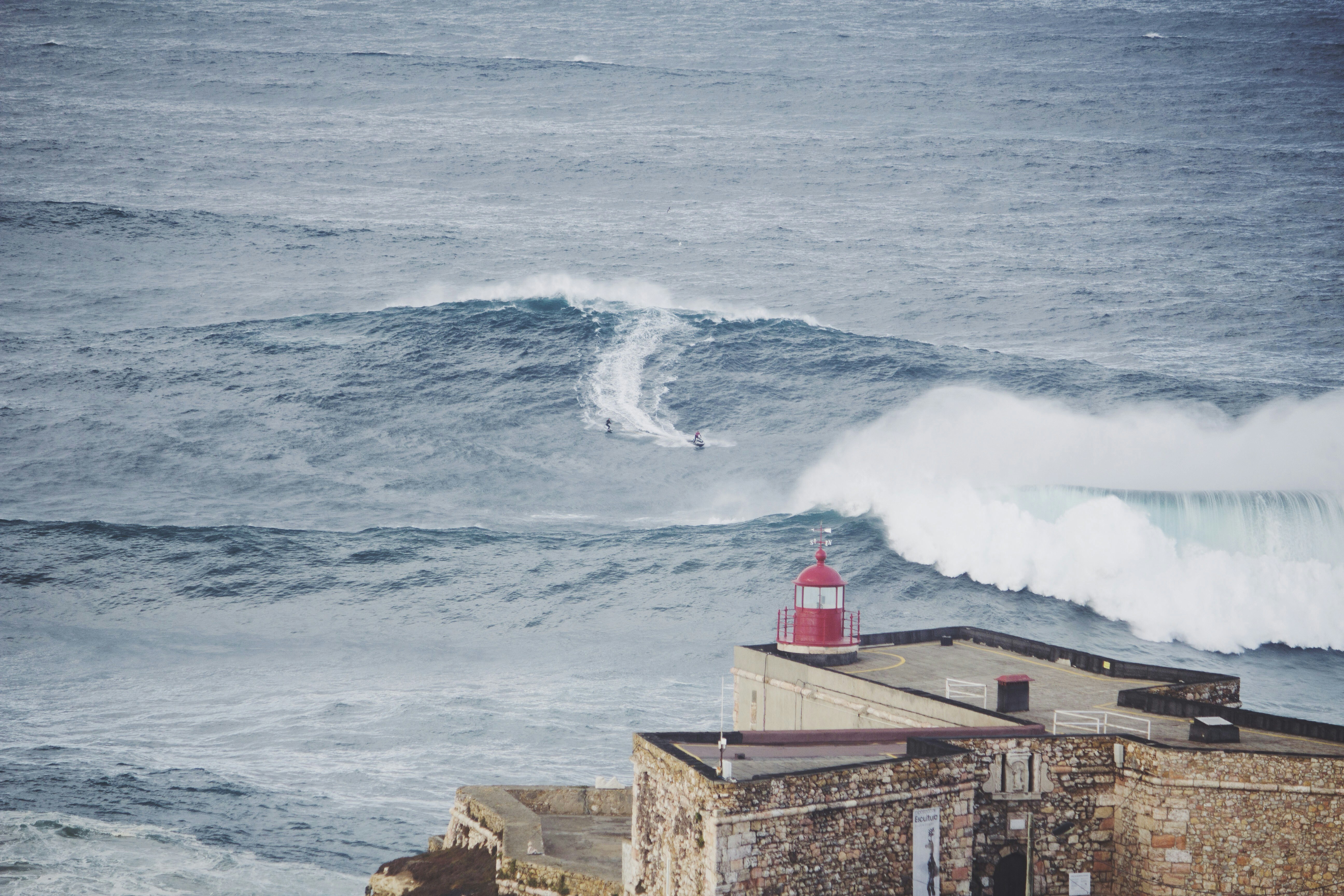 Surfing at Nazaré (Praia do Norte), Leiria, Portugal