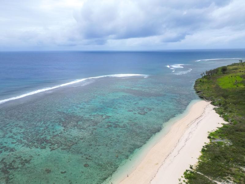 Surfing at Ha'atafu Beach, Tongatapu, Tonga